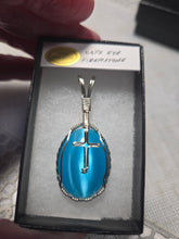 Load image into Gallery viewer, Custom Wire Wrapped Blue Fiberstone (Cats Eye) with Cross Necklace/Pendant Sterling Silver